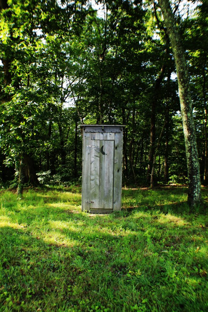 gray wooden outdoor portable bathroom